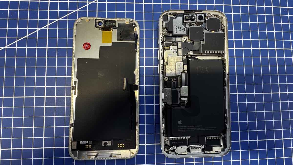 Аккумулятор и Taptic Engine в собранном из доноров iPhone 15 Pro